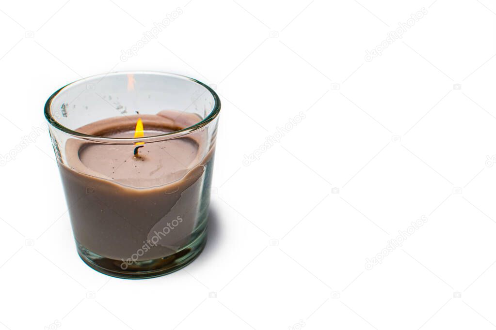 Burning grey candles on a white background