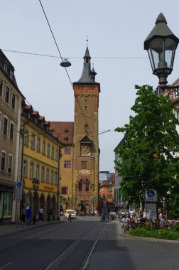 Wurzburg, Germany - May 11, 2015: People cross the old Main Bridge across the river