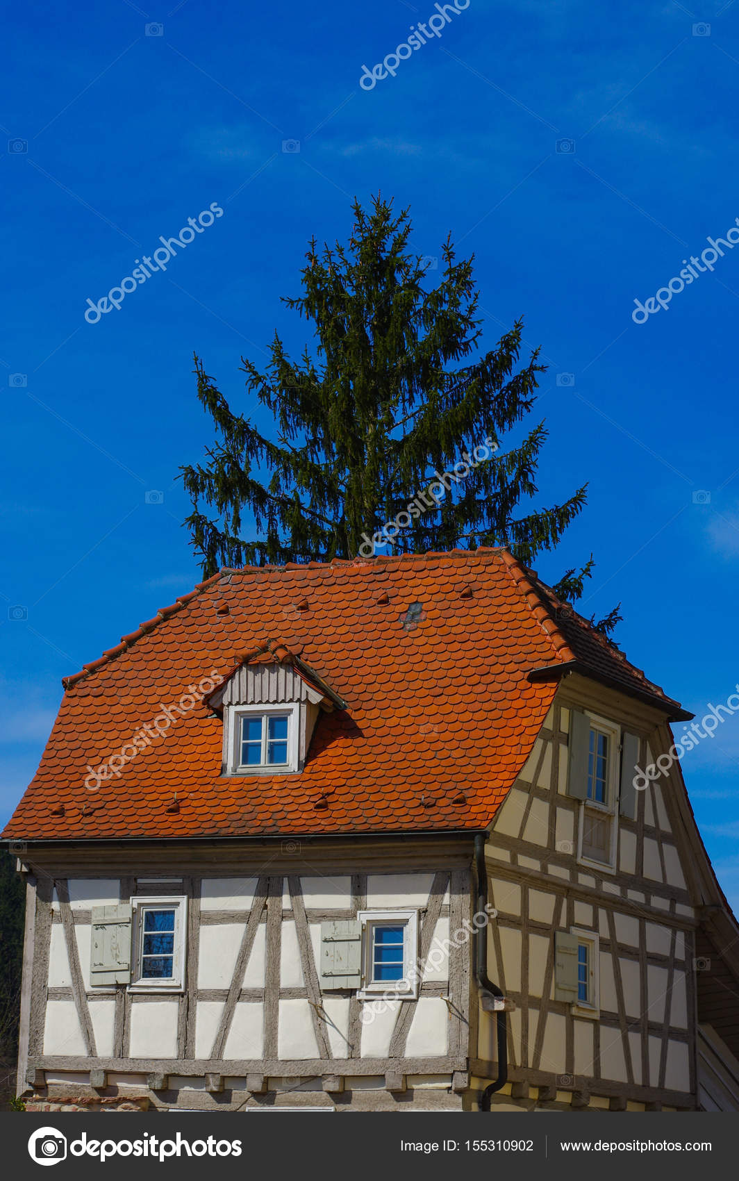 Residential Tudor Style House With Blue Sky In Background Stock Photo 