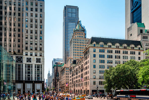 New York, NY / USA - July 12 2014: View of the junction of Fifth Avenue and 58th street, in midtown Manhattan.