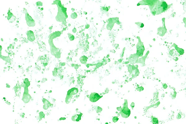 Green watercolor abstract background. Beautiful spreading paint on white watercolor paper. Hand painting. Picture for desktop, design or greeting card.