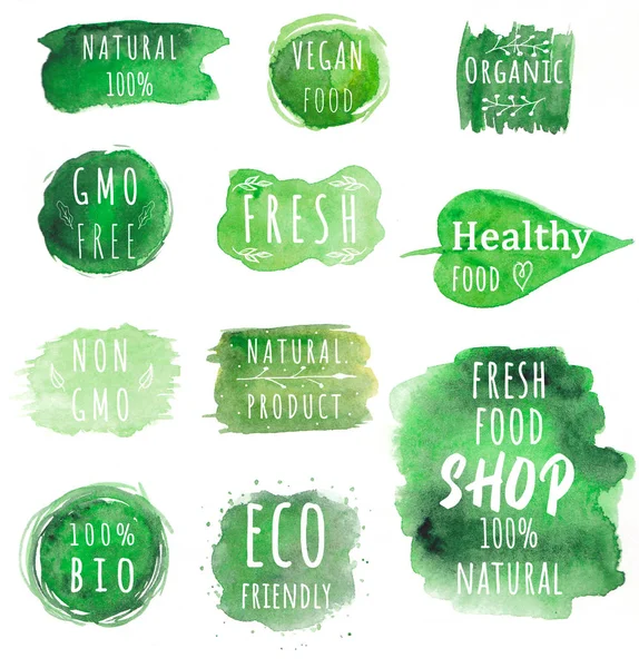 Set of Eco, organic labels. Green abstract hand drawn watercolor background. Natural, organic food or cosmetic. Bio and eco design elements.