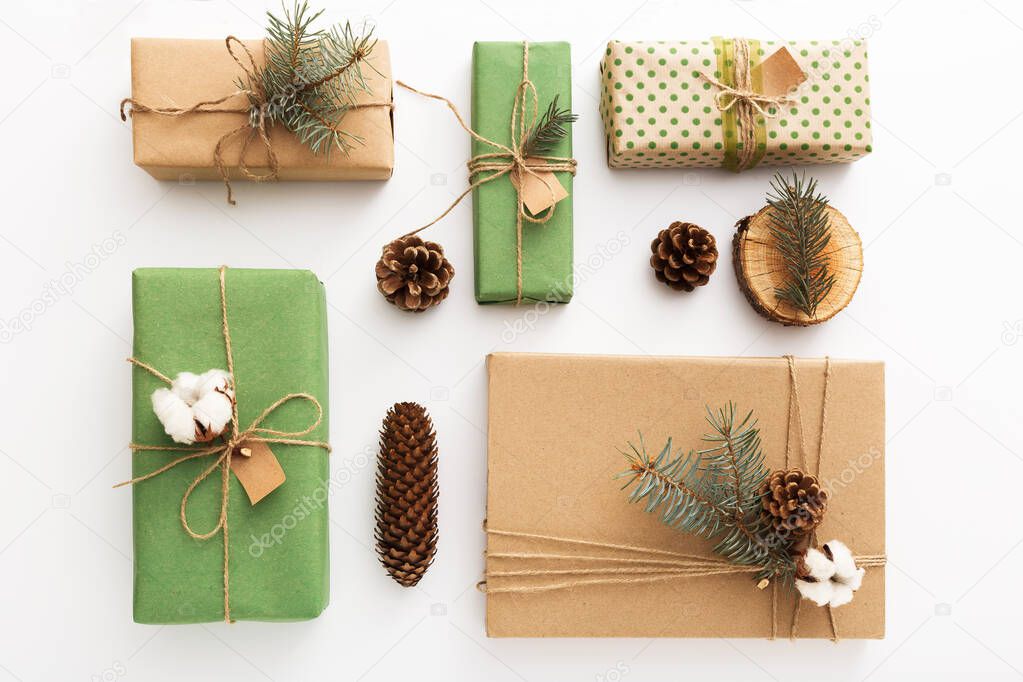 Christmas composition made of pine cones, brunches, tree rings, crafted gifts with no plastic on white table. Christmas, Xmas, winter, new year, Zero waste concept.Top view, copy space, flat lay.