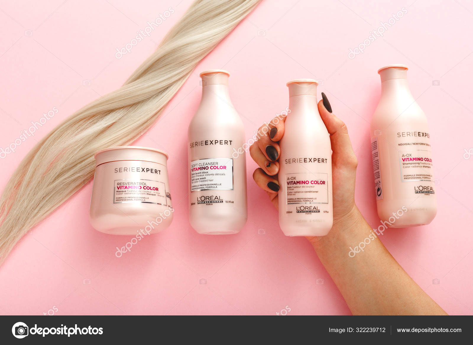 L'oreal professionnel Paris Serie Expert Vitamino Color hair professional set.Loreal shampoo mask.strand of blonde hair on pink background.Pink cosmetics bottles. Flat lay copy space Stock Editorial Photo © beton_studio #