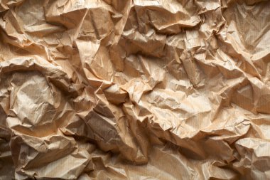 Buruşuk el işi kâğıdı geçmişi. Krem kağıt dokusu. Soyut doku stok fotoğrafı arkaplanı. Dizayn için eski buruşmuş sayfa boş deseni.