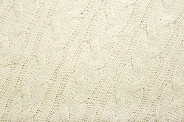 Beige knitted fabric wool texture for background. Close up of White Knitted material pattern for design. Beige warm sweater textile background. — Stock Photo, Image