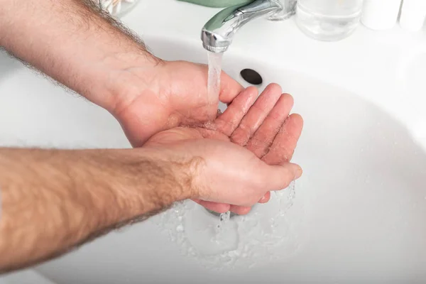 Man washing hands with antibacterial soap and water. Hygiene concept. Coronavirus protection hand hygiene antiseptic. Skin disinfectant for healthcare.