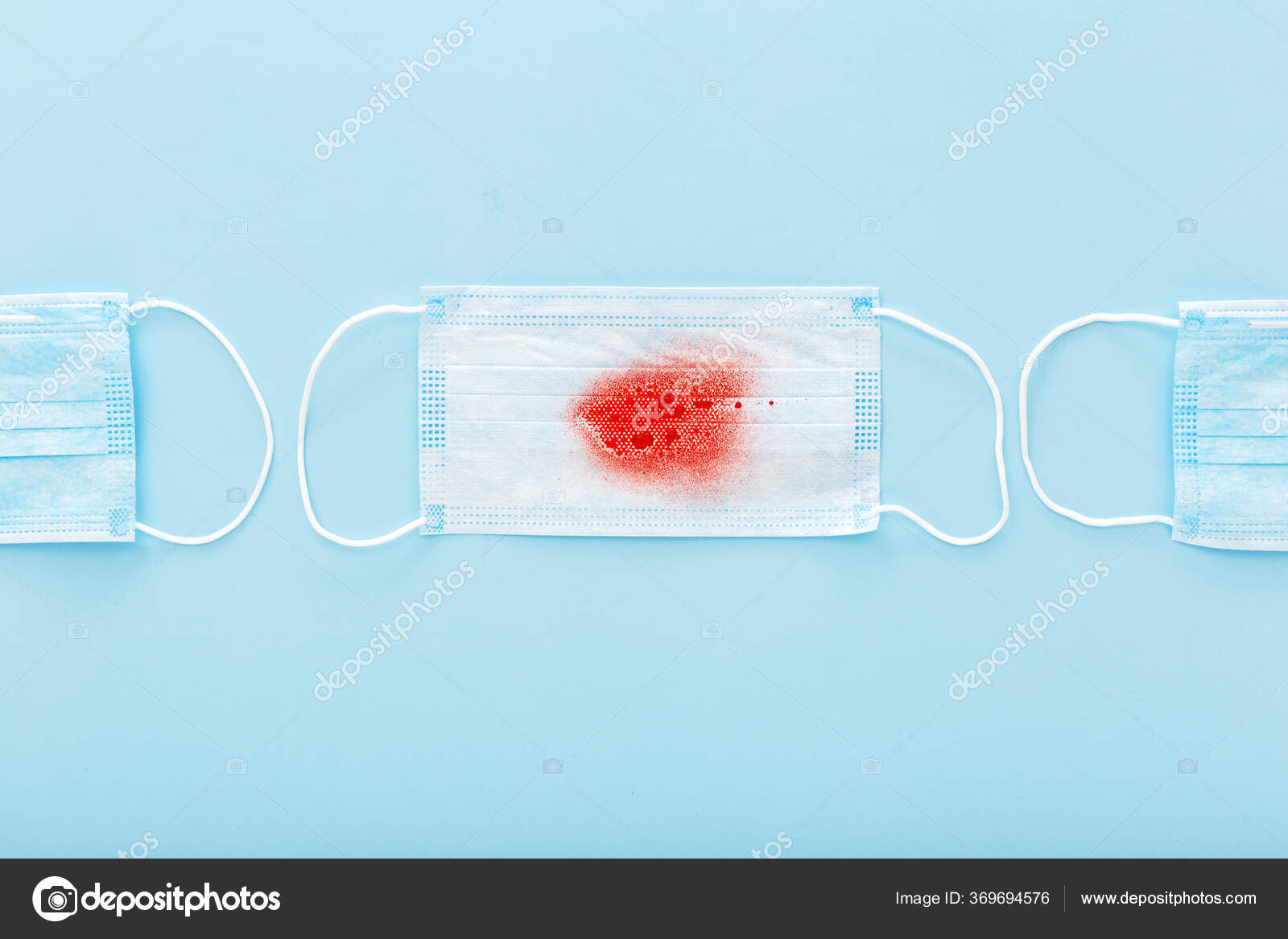 Hemoptysis, coronavirus, protective surgical masks with blood on blue background. Pneumonia
