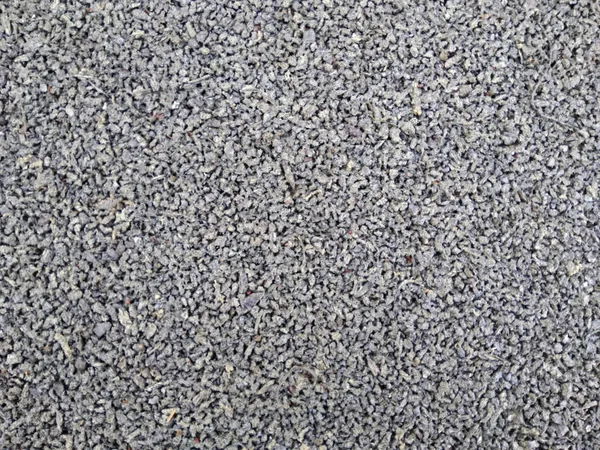 Seamless asphalt grey background. Coating of rubber crumbs. Texture coating of concrete.