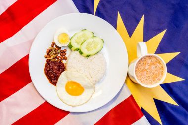 Malaysian Breakfast - Nasi Lemak and Teh Tarik on Malaysia Flag.