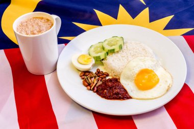 Malaysian Breakfast - Nasi Lemak and Teh Tarik on Malaysia Flag.