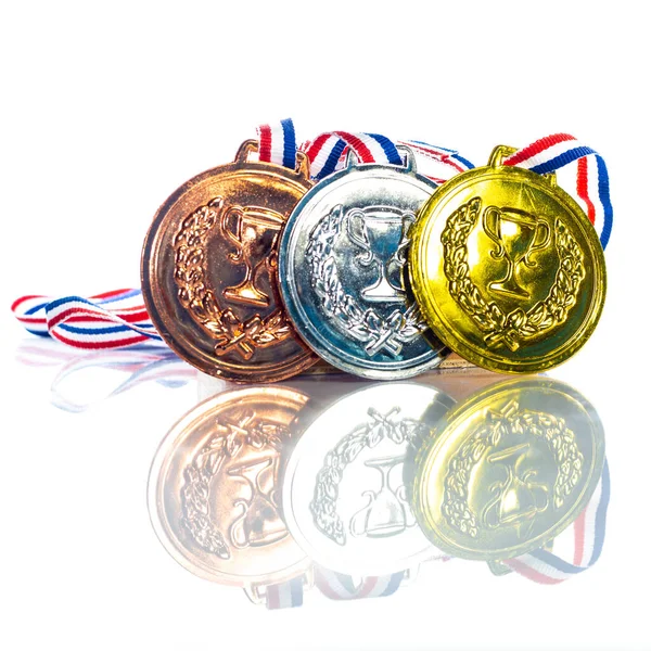 Medals Gold Silver Bronze Isolated White Reflected Shallow Depth Field Stock Image