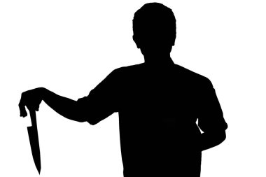 Bıçak tutan, kimliği belirsiz bir adamın silueti.