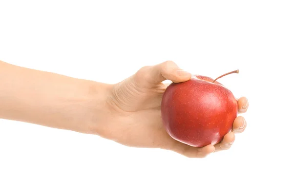 Note di alimentazione e dieta: mano umana con una mela rossa isolata su fondo bianco negli studi — Foto Stock