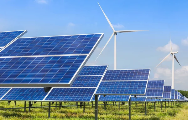 solar cells and wind turbines generating electricity in power station