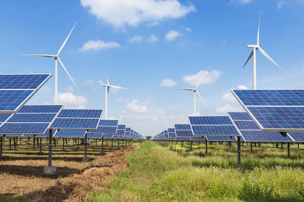 Solar cells with wind turbines generating electricity in hybrid power plant systems station alternative renewable energy from nature — Stock Photo, Image