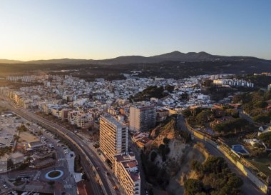 Aerial panoramic view of Arenys de Mar city at dawn. Located in El Maresme, Barcelona, Spain. clipart