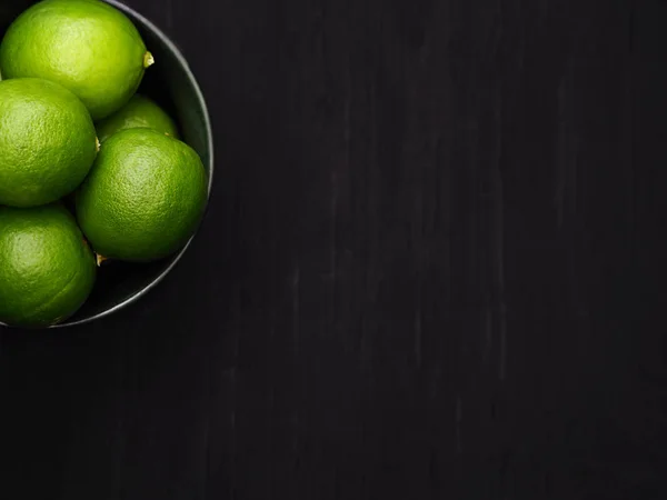 Fresh limes on dark tone background. Detox and healthy, High Vitamin C