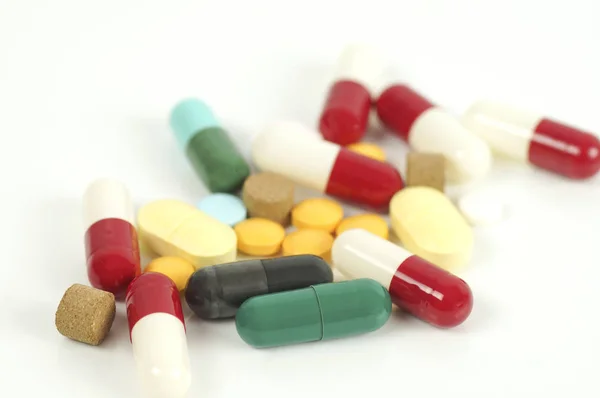 Capsule and drug on white background — Stock Photo, Image