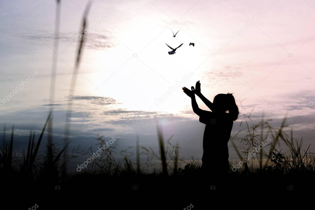 silhouette people making hand as bird and release birds to be freedom and free