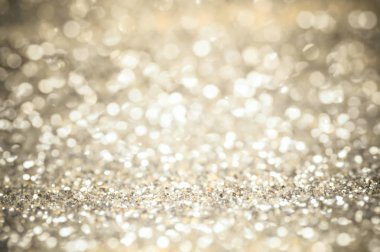 odak glitter vintage ışıklar arka plan. Altın, gümüş ve siyah Noel ve yeni yıl arka planı için.