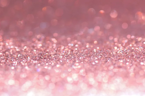 defocus of glitter vintage lights background. pink,white and black for Christmas and new year background.