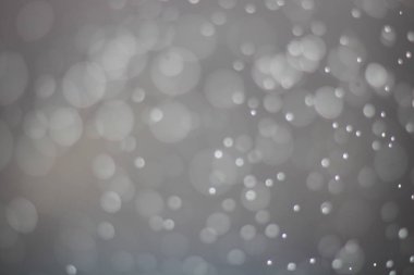 Beyaz ve gri köpüklü ve bokeh arka plan bulanıklık