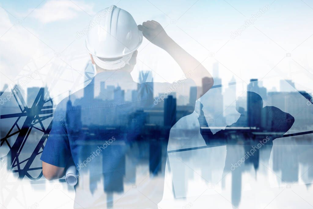 smart city and high construction development concept, double exposure engineer touching helmet to looking forward with city