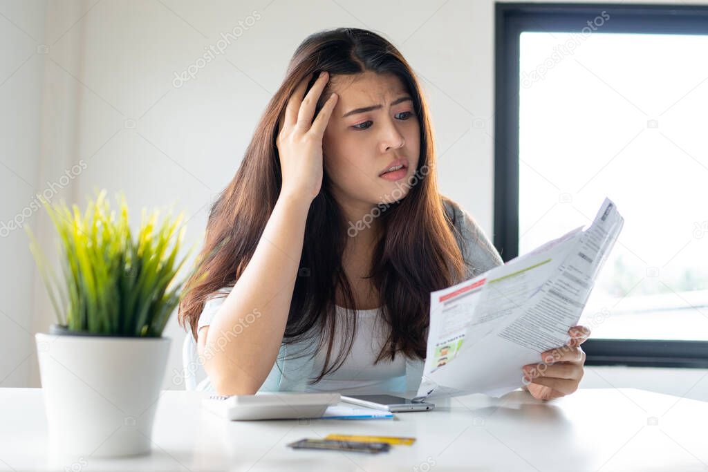 Woman looking worried about bill, No money to paying credit card and debt