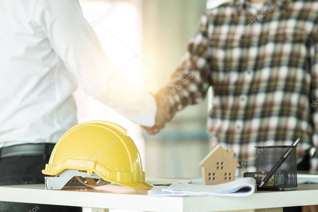 engineer shake hand with building contractor