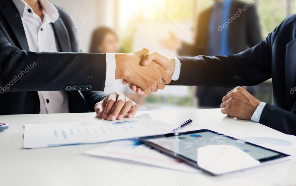 Business people making handshake, successful negotiation and agreement of partnership communication