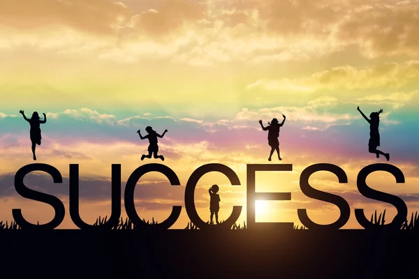 Silhouette of group woman jumping against sunset with success wo — Stock Photo, Image