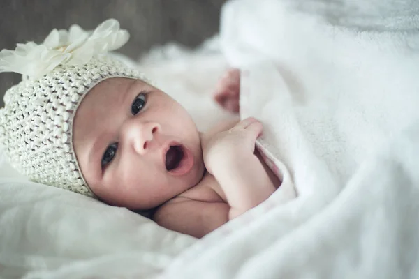 Newborn child relaxing in bed after bath or shower. Nursery for — Stock Photo, Image