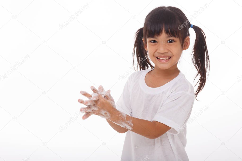 child washing hands and showing soapy palms.on white background