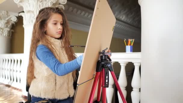 Young Girl Curly Long Hair Sits Easel Draws Pencil Camera — Stock Video