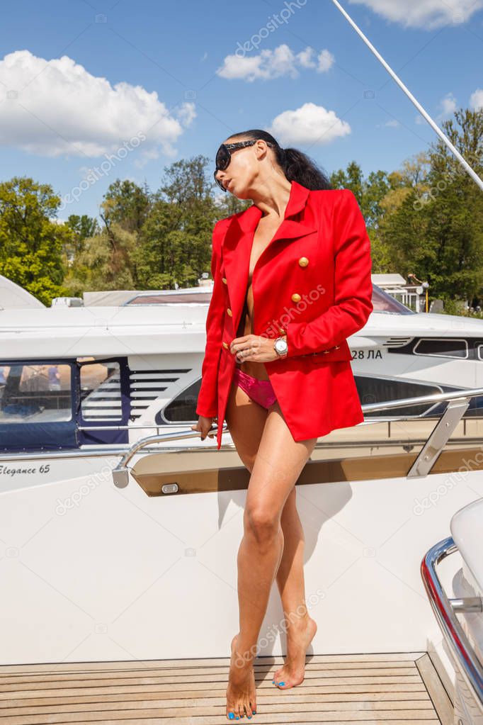 young woman posing on yacht