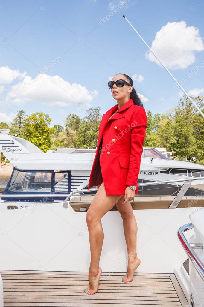 young woman posing on yacht