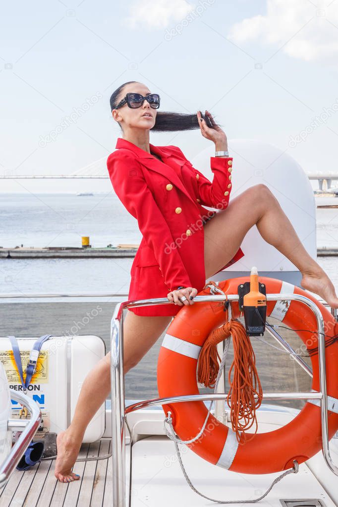 young woman posing on yacht