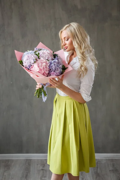 blonde  woman with hydrangea bouquet