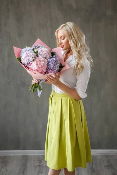 blonde  woman with hydrangea bouquet