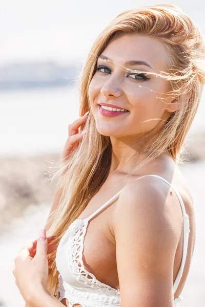 Blonde young woman in white bra — Stock Photo, Image