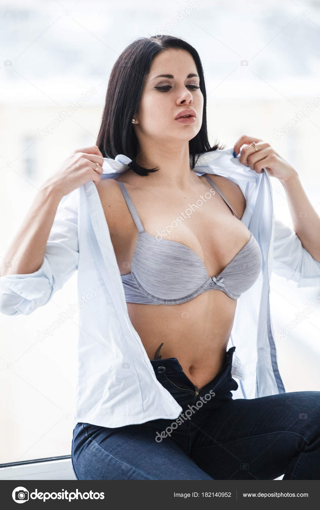 Young Sexy Brunette Wearing Black Bra, White Shirt And Blue Jeans Stock  Photo, Picture and Royalty Free Image. Image 53116717.