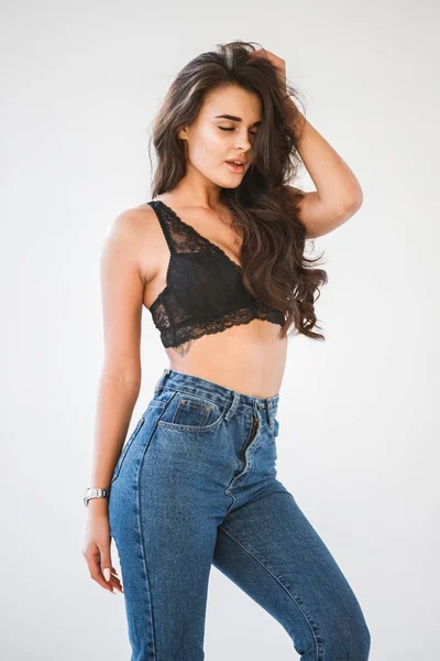 Studio Portrait Beautiful Curly Brunette Girl Wearing Blue Jeans Sexual — Stock Photo, Image