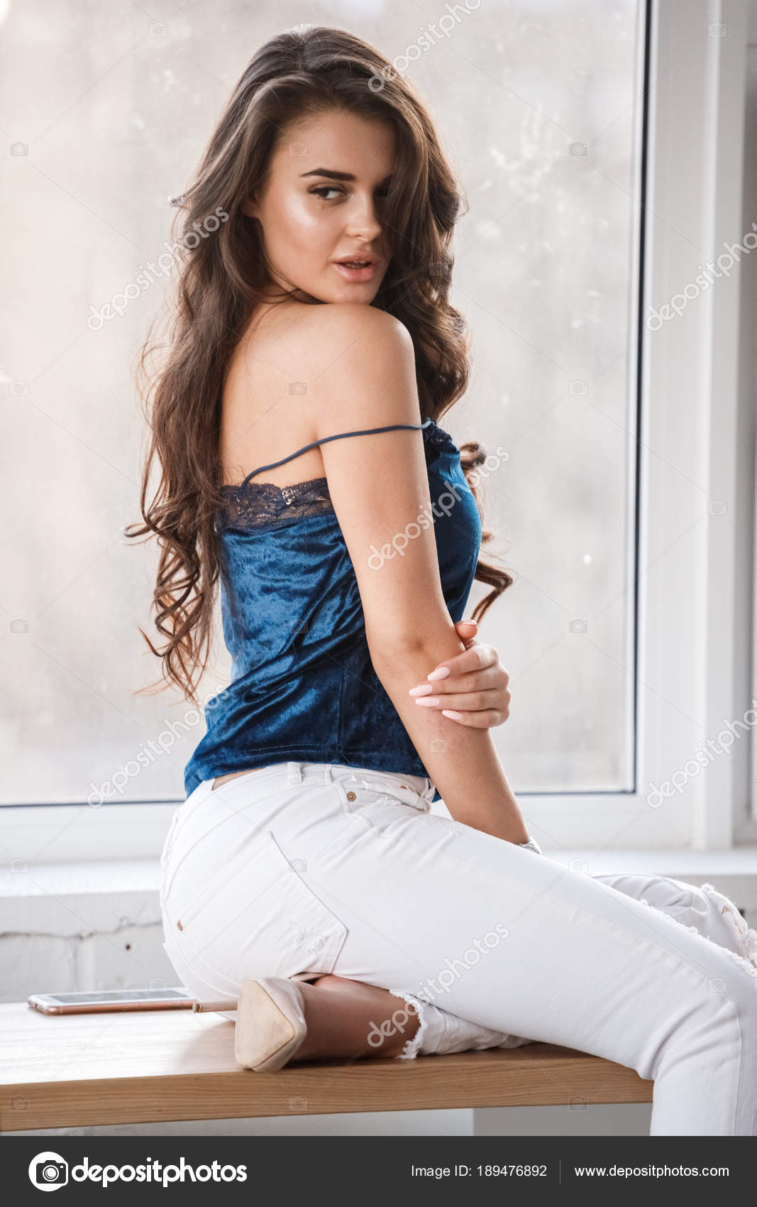 Portrait Young Sexy Brunette Girl Blue Lingerie White Pants Sitting Stock  Photo by ©schummyone 189476892