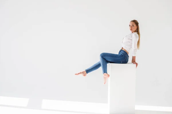 Portrait Sexy Blonde Girl Wearing Blue Jeans White Shirt Sitting — Stock Photo, Image