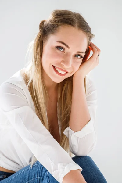 Portrait Sexy Blonde Girl Wearing Blue Jeans White Shirt Sitting — Stock Photo, Image