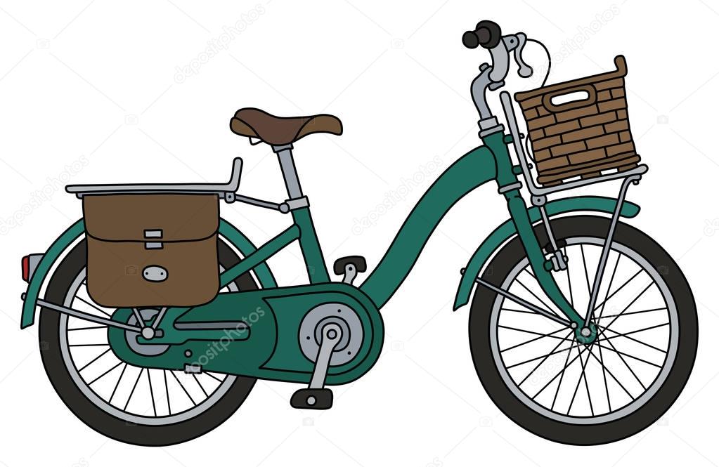 The classical green bicycle with a basket
