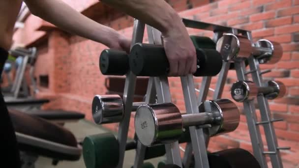 Girl Takes Dumbbells Rack Gym Puts Them Back Close Face — Stock Video