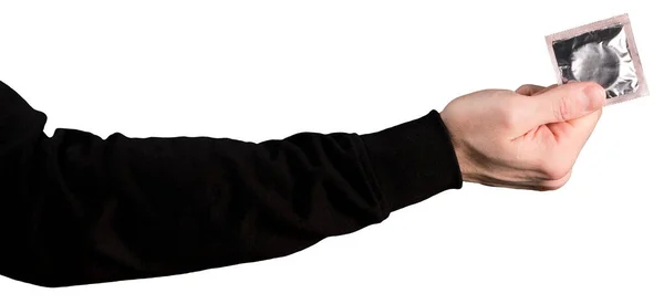 Mężczyzna Ręka Czarny Kaptur Rękaw Trzyma Lub Trzyma Prezerwatywy Odizolowany — Zdjęcie stockowe