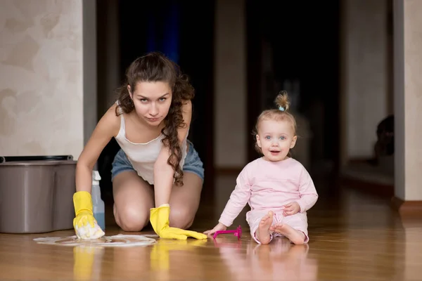 Mother Cleaning Floor Child Sitting Nearby Woman Washes Floor Pranks — Stock Photo, Image